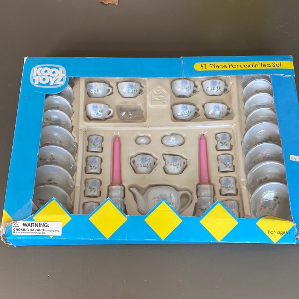 Kool Toyz is 40 piece porcelain tea set, one tea cup missing